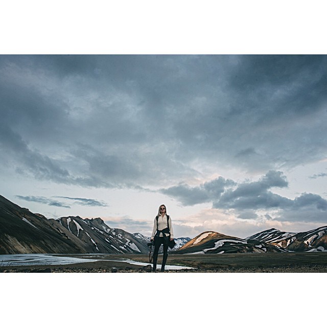 Dramatic Icelandic landscape with volcanic rock formations and distant glaciers