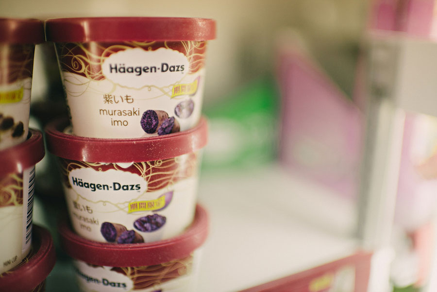 Japanese purple sweet potato Haagen-Dazs ice cream containers stacked in a convenience store freezer