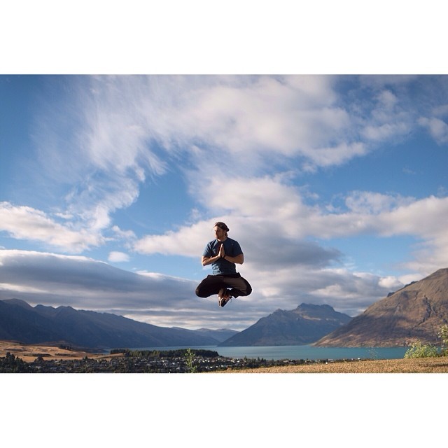 Early morning meditation on a calm New Zealand lake with mountain reflections