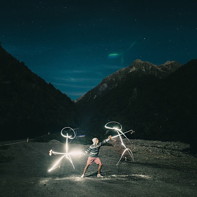 Light painting at night with mountains and stars in the New Zealand backcountry