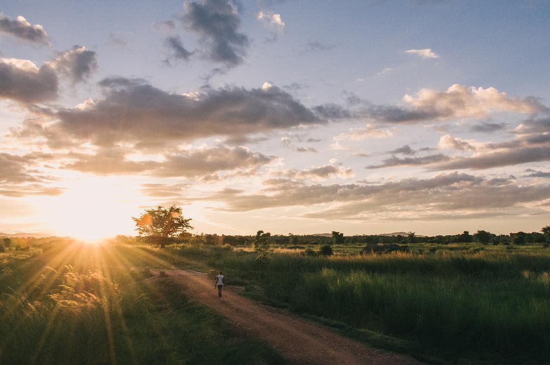 View from a vehicle window on the road through rural Kenya